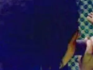 Beauty caresses hairy kitty on the floor