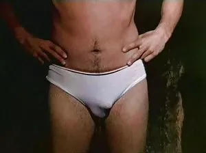 Two man Snoke a girl on a wild beach