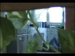 A crumb in a corset and stockings is played with a vibrator