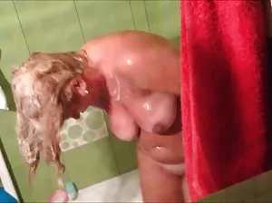 Sexy girl throws slender legs behind her head and masturbates pussy