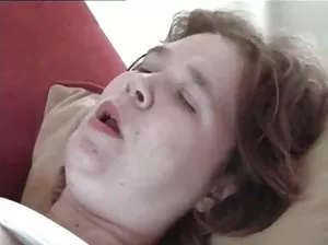 Fat old man sitting on a couch overcuts his dick thinking about a young boy