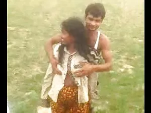 Liberated nudists lie on the shore and sunbathe