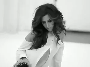 Naked woman spreads her labia and shows wet pussy