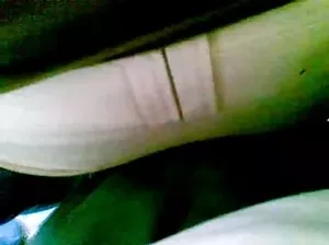 Yana sat down on the bench in the yard and fingering