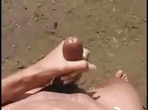 Playful girl erotic posing with umbrella by the lake