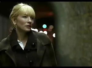 Tattooed girl in a corset and high boots sits at the guy on the face