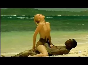 Naked chick skiing on a mountain slope